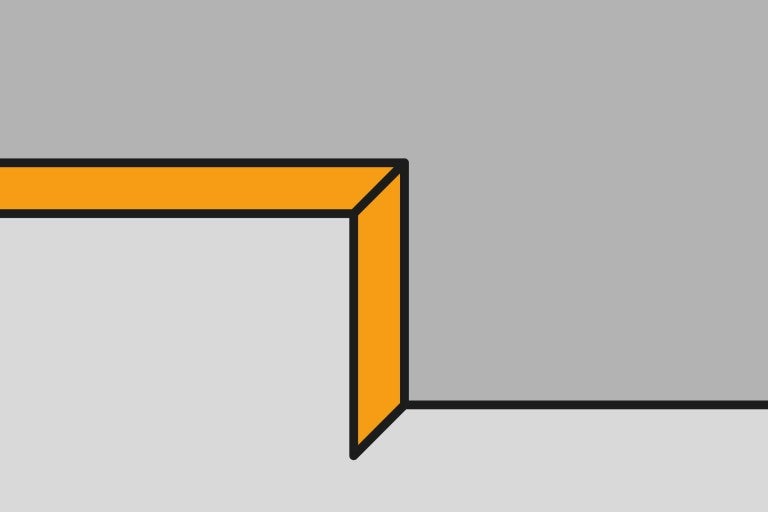 Vyobrazení rohu místnosti s ozdobnou lištou