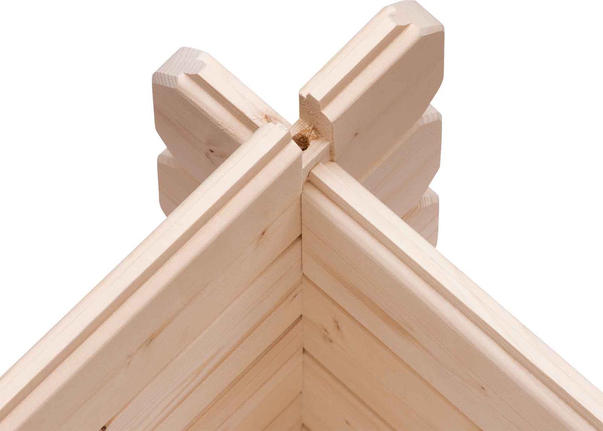 Detail rohového spoje z dřevěných trámů