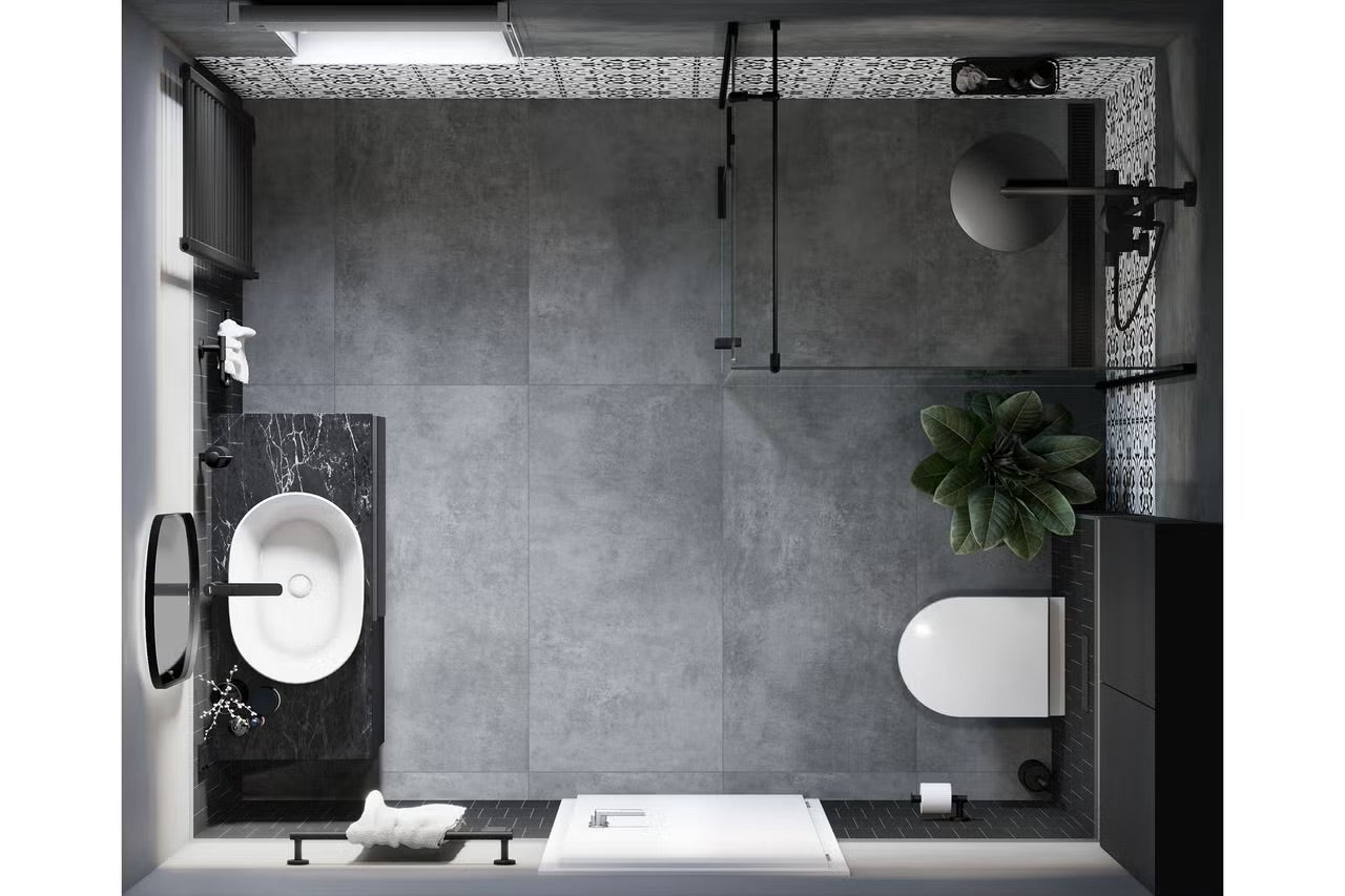 Pohled shora na koupelnu s umyvadlem, toaletou, sprchou a šedými dlaždicemi