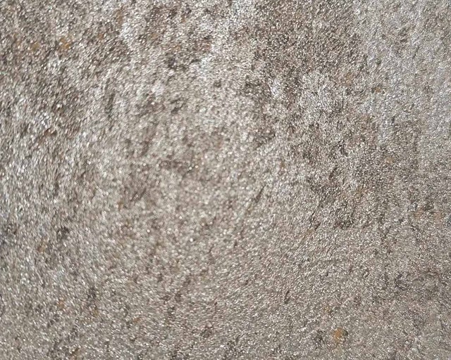 Texturovaný povrch s kovovým leskem pro obklady stěn nebo tapety