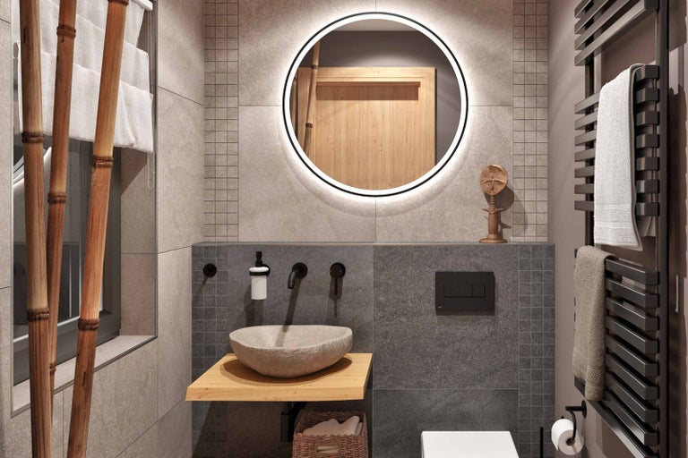 Světlá koupelna s kamenným umyvadlem, zrcadlem s osvětlením a radiátorem na ručníky