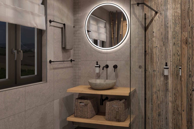 Moderní koupelna s kulatým zrcadlem, umyvadlem a dřevěnými prvky