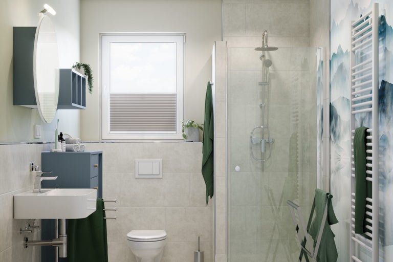 Světlá koupelna se sprchou, umyvadlem a toaletou.