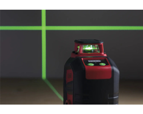 Červený a černý rotační laser promítá zelené laserové čáry.