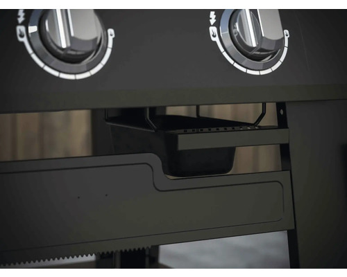 Detail grilu s otočnými knoflíky a odkapávací miskou