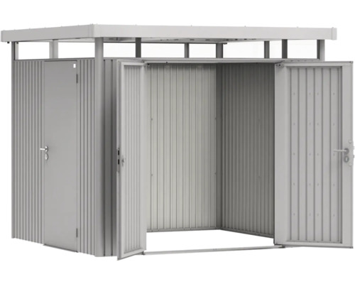 Kovový zahradní domek se dvěma dveřmi a bočním vchodem.