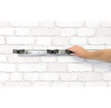 Nástěnný držák na násady s rukou