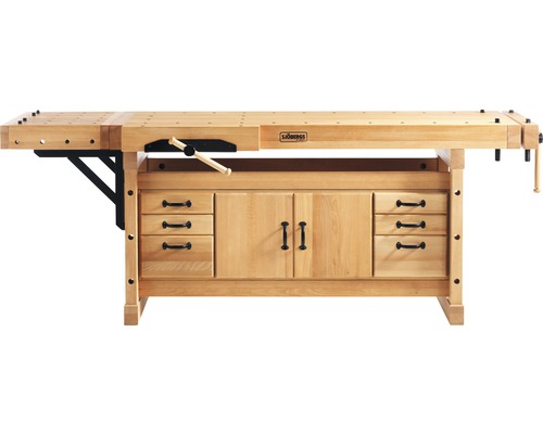 Dřevěná pracovní lavice se zásuvkami a skříňkami.