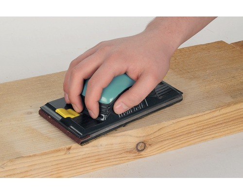 Ruční bruska s dřevěnou deskou