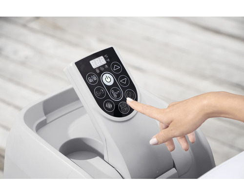 Ovládací panel přenosné vířivky s digitálním displejem a různými funkčními tlačítky, ovládaný rukou.