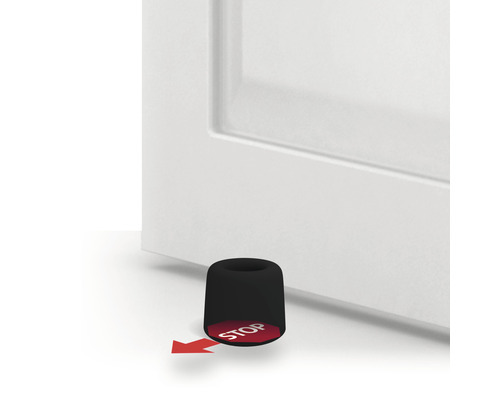 Dveřní zarážka před dveřmi s červenou šipkou a slovem Stop