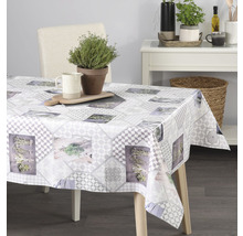 Jídelní stůl s šedým vzorovaným ubrusem, bylinkový vzor