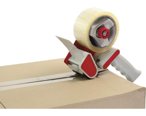 Odmotávač lepicí pásky v provozu na kartonové krabici