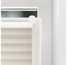 Detailní pohled na plisovanou žaluzii v okně