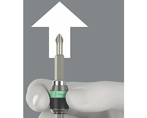 Křížový šroubovací bit s bílým značením, držený rukou.