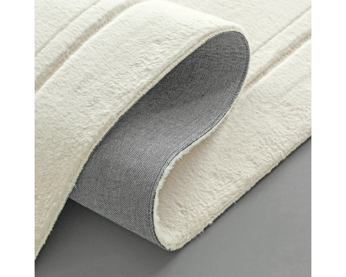 Detail bílého koberce se strukturou