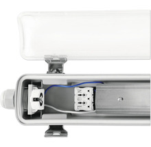 Vnitřní pohled na trubicové zářivkové svítidlo s otevřeným krytem pro zobrazení elektrických součástí