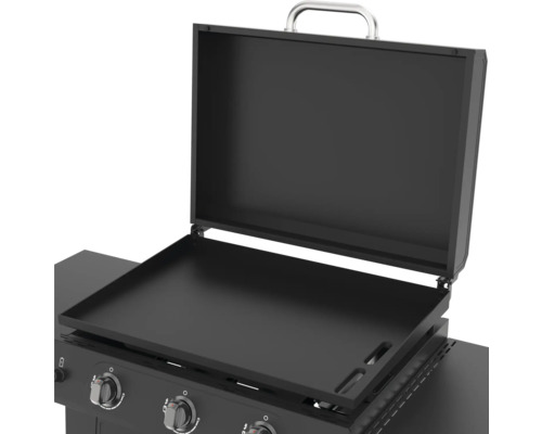 Otevřená grilovací deska s krytem a ovládacími prvky.