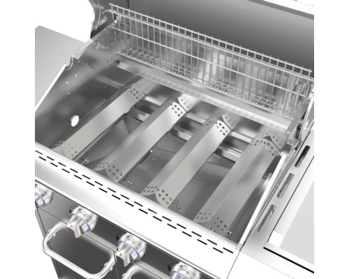 Vnitřní pohled na plynový gril s grilovacím roštem a hořáky z nerezové oceli