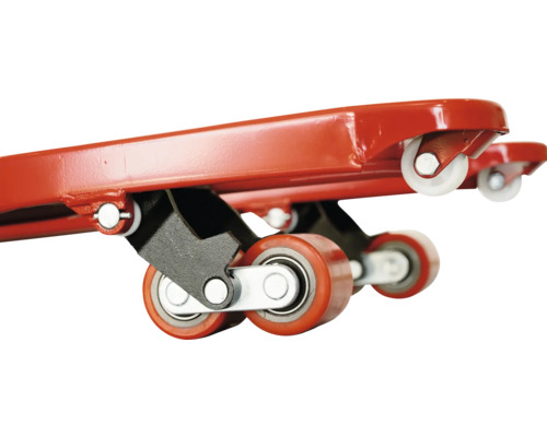 Detailní pohled na nábytkové kolečko s červenými a bílými kolečky.