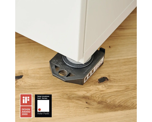 Nábytkový kluzák pod kusem nábytku na dřevěné podlaze. Logo iF Design Award. Logo Red Dot.