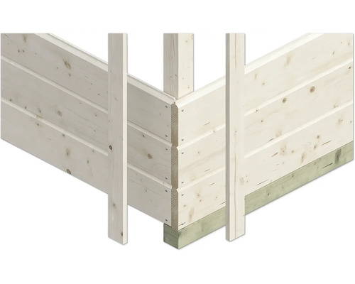 Detailní pohled na konstrukci stěny z masivních dřevěných trámů