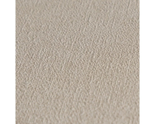 Detail béžové tapety s hrubou strukturou