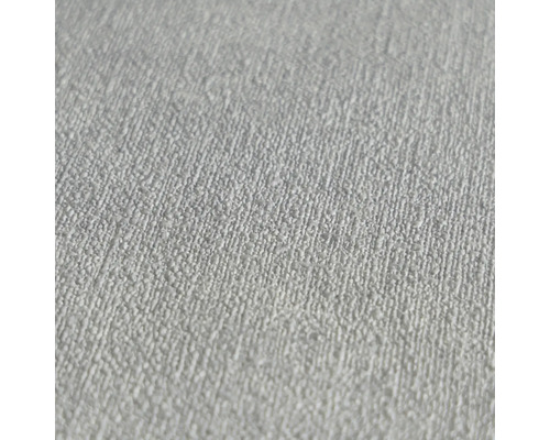 Detail bílé strukturované tapety