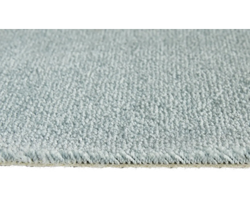 Detail světlého koberce