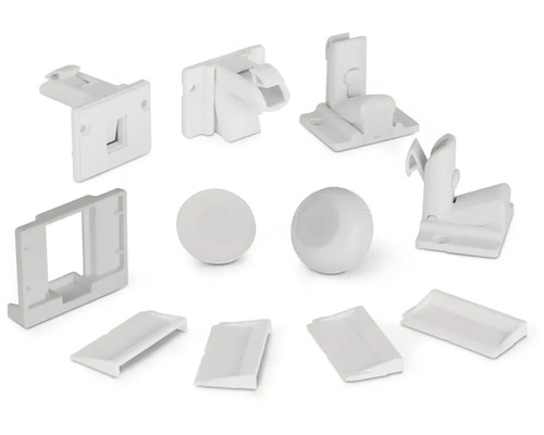 Různé bílé nábytkové kování