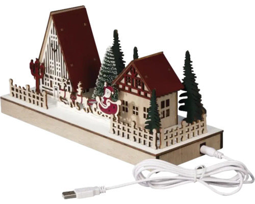Dekorativní vánoční scéna s domy, stromy, saněmi a USB kabelem