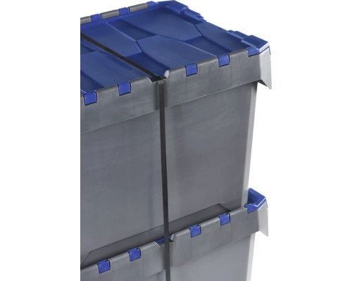 Dva šedé plastové boxy s modrým víkem a upínacím popruhem naskládané na sobě