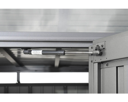 Detail plynové pružiny na zahradním domku