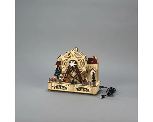 Vánoční dekorace s osvětleným dřevěným ruským kolem