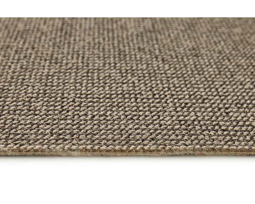 Detail béžového koberce s textilní strukturou