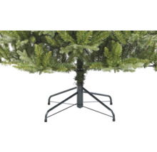 Detail umělého vánočního stromku s kovovou základnou