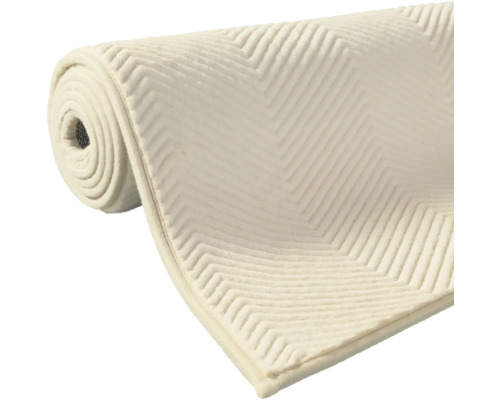 Srolovaná podložka pod koberec s klikatým vzorem