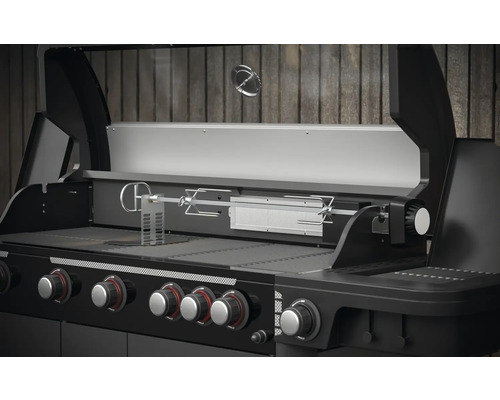 Plynový gril s funkcí otočného rožně a několika regulátory.