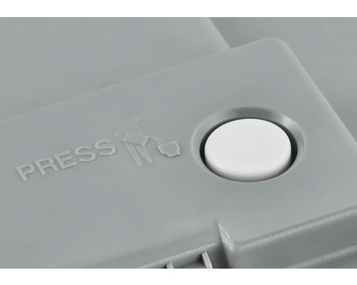 Tlačítko se symbolem a nápisem ''Pressen''.