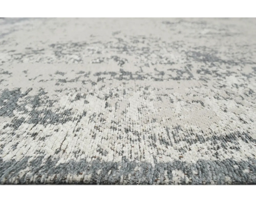 Detail koberce s abstraktním vzorem