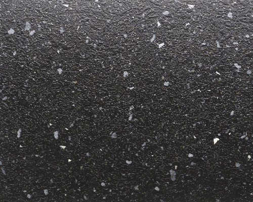 Černý povrch se skvrnitou texturou