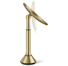 Zlaté kosmetické zrcadlo se stojanem.