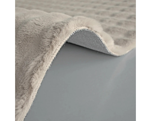 Detail šedého koberce s vlasem