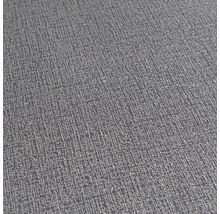 Detailní záběr šedé strukturované tapety