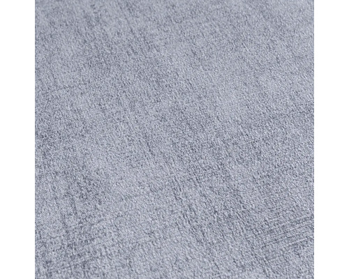 Detail světlé, strukturované textilie.