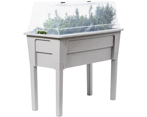 Zvýšený záhon s bylinkami a průhledným krytem do zahrady