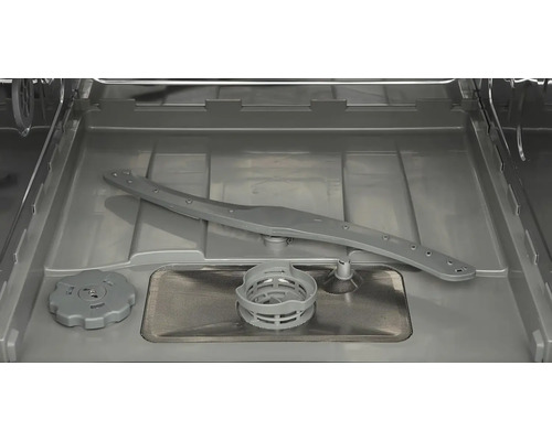 Vnitřek myčky s ostřikovacím ramenem a filtrem