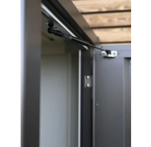 Detailní pohled na plynovou pružinu na skříni na nářadí.