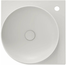 Pohled shora na umyvadlo na desku ze sanitární keramiky s kulatou mísou a čtvercovým základním tvarem