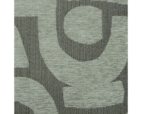 Detailní pohled na koberec s písmenným vzorem